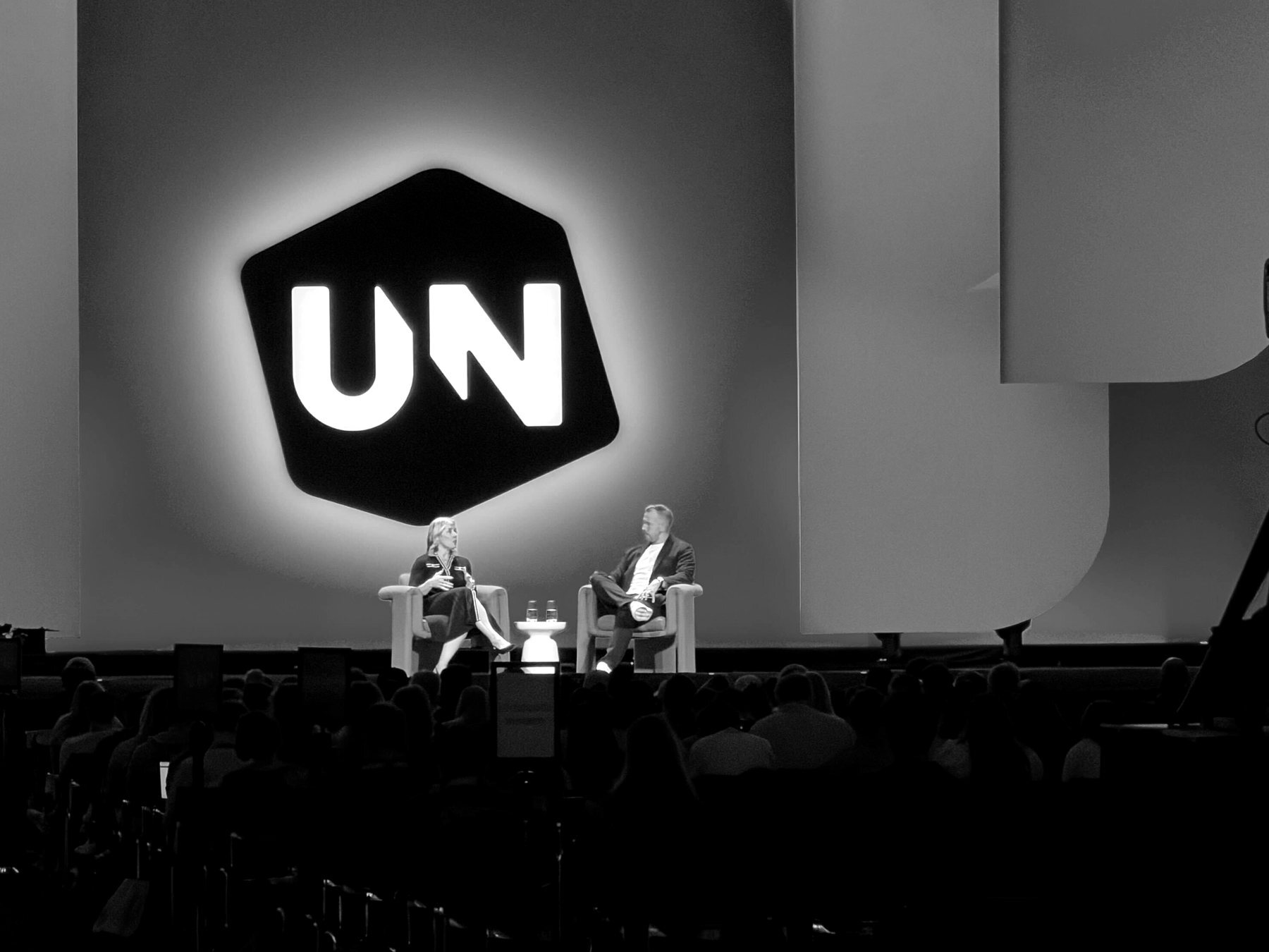 Kyle Denhoff speaking on stage